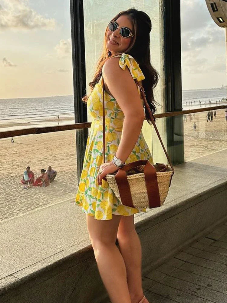 Zomerjurk met limoenprint geel zijprofiel