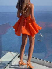 Orange mini dress halter neck back view with bow detail