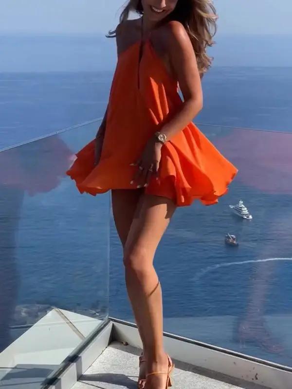 Orange mini dress halter neck side view with bow detail