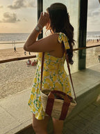 Zomerjurk met limoenprint, wit en geel, ruggezicht