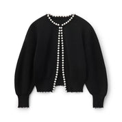 Black cardigan with pearl trim detailing, front view