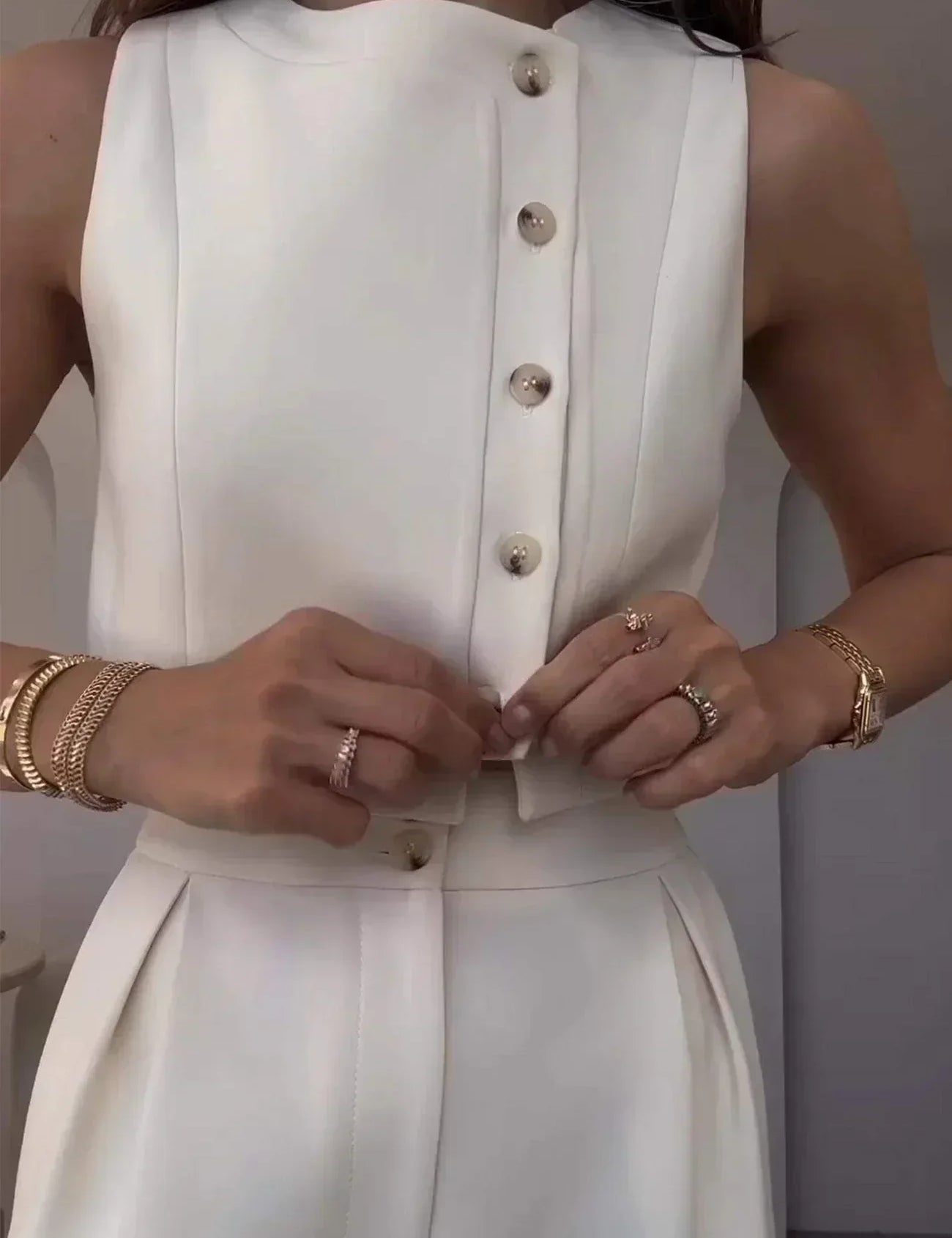 Close-up of white co-ord set buttons