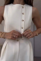 Close-up of white co-ord set buttons