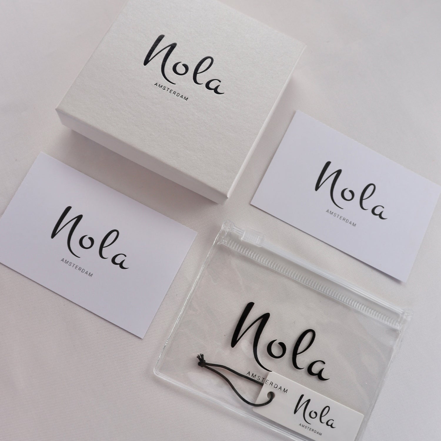 Nola jewelry packaging with white box and tag