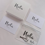 Nola jewelry packaging with white box and tag