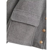 Gray jacket pocket detail with gold buttons