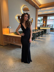 Evening dress black front view with hand on hip