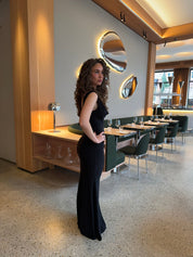 Evening dress black side view with hand on hip