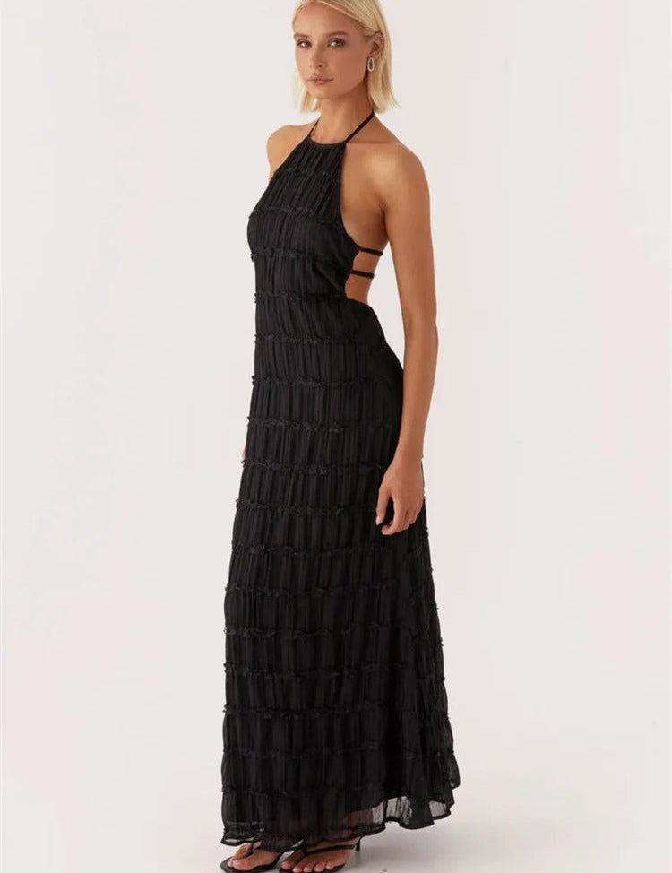 Elegante zwarte maxi-jurk met open rug en plooien, front view