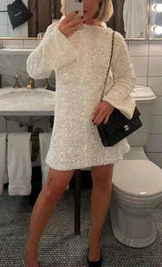 White sequin dress with black bow full body front view