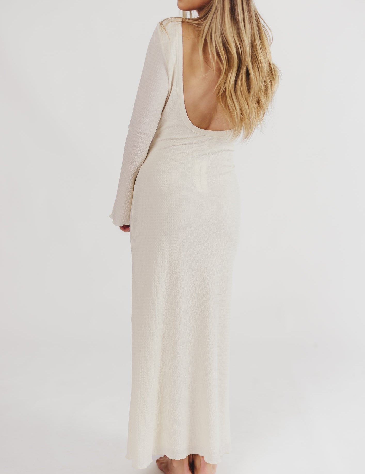 Cream textured maxi dress with bell sleeves back view