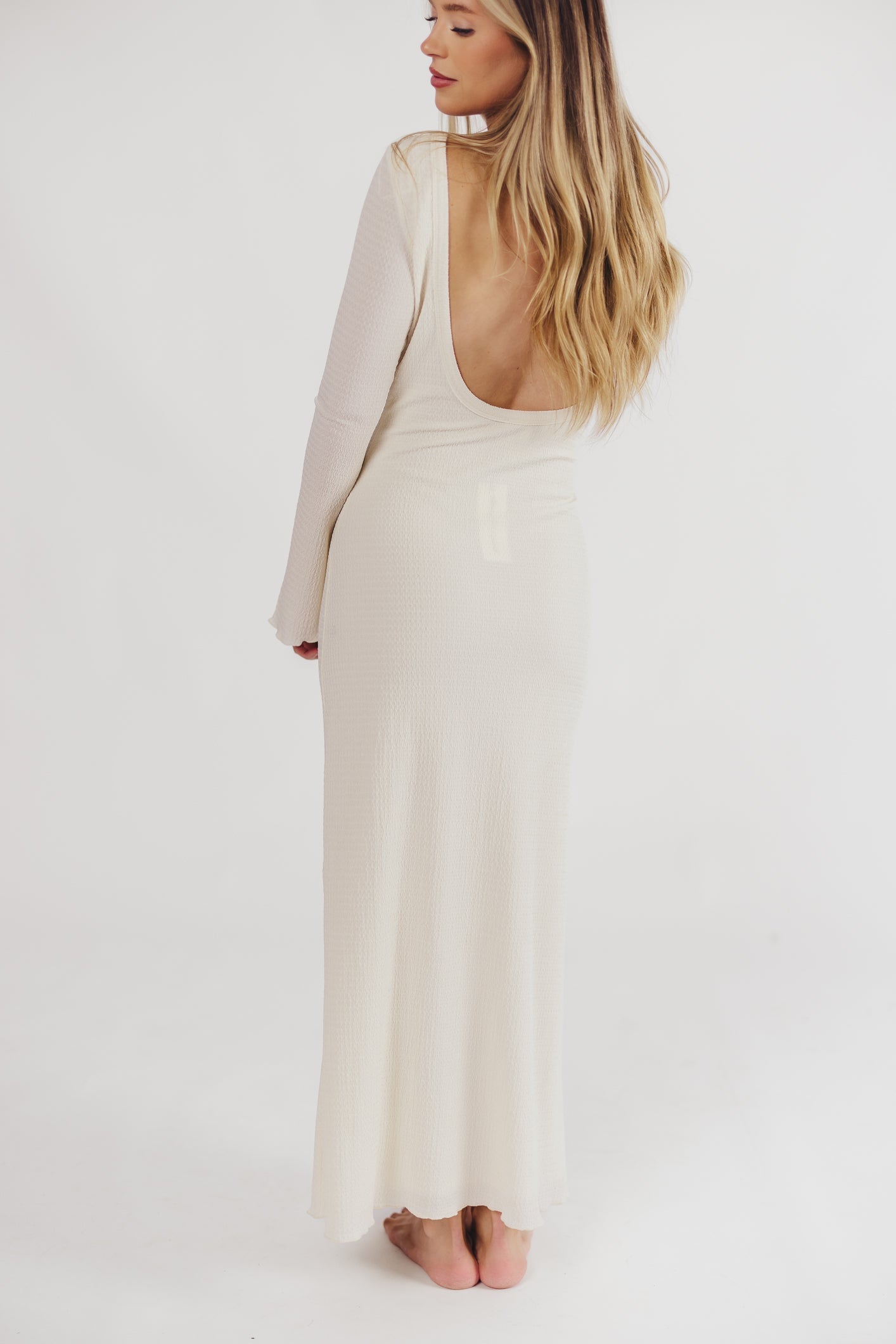 Cream textured maxi dress with bell sleeves back view