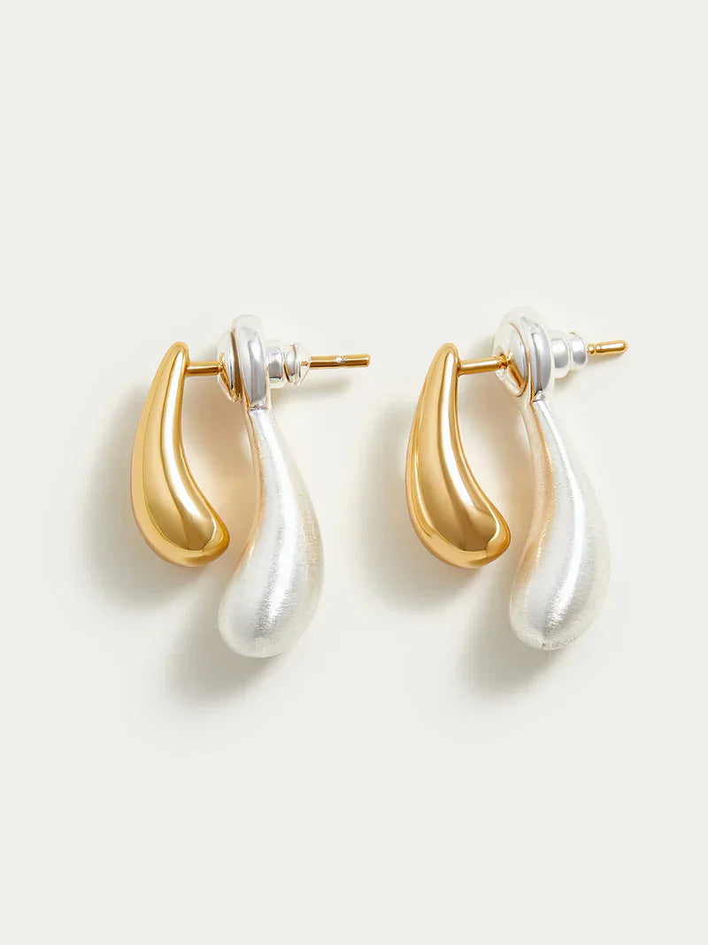 Gold and silver earrings teardrop design angled view