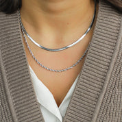 Silver layered necklaces worn on neck