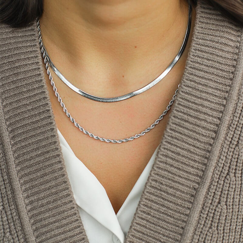 Silver layered necklaces worn on neck