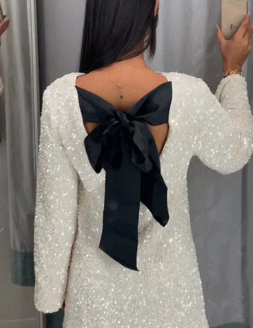 White sequin dress with black bow back view