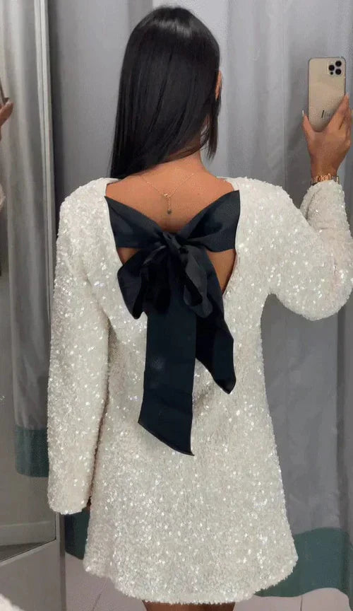 White sequin dress with black bow back view