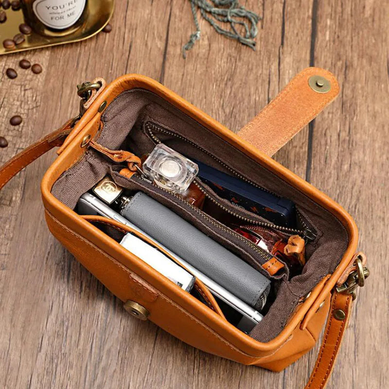 Leren schoudertas oranje met interieur detail